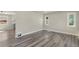 Open floor plan showcases updated flooring, neutral paint, base trim, and modern lighting at 3636 Ames St, Wheat Ridge, CO 80212