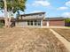 House exterior showcasing backyard, patio, and partial brick elevation at 10825 Brewer Dr, Northglenn, CO 80234