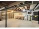 Unfinished basement with shelving, workbench, and utilities at 10825 Brewer Dr, Northglenn, CO 80234