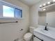 Updated bathroom, featuring a white vanity and modern fixtures at 10825 Brewer Dr, Northglenn, CO 80234