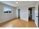 Well-lit bedroom with hardwood floors and a large closet at 10825 Brewer Dr, Northglenn, CO 80234