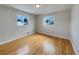 Spacious bedroom with hardwood floors and neutral walls at 10825 Brewer Dr, Northglenn, CO 80234