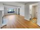 Living room with hardwood floors and fireplace, access to sunroom at 10825 Brewer Dr, Northglenn, CO 80234