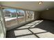 Sunroom with large windows offering backyard views at 10825 Brewer Dr, Northglenn, CO 80234