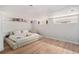 Modern bedroom features hardwood floors, a platform bed, and unique decor for a minimalist and stylish space at 720 Lipan St, Denver, CO 80204