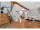 Inviting foyer with hardwood floors, an open staircase, and a glimpse into the dining and living areas at 720 Lipan St, Denver, CO 80204