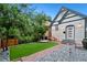 Charming home with a green yard, brick walkway, and inviting front porch at 720 Lipan St, Denver, CO 80204