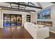 Living room featuring a fireplace, TV, sliding glass door and hardwood floors at 720 Lipan St, Denver, CO 80204