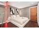 Stylish bedroom with a modern bed frame, wood floors, and minimalist wall art at 720 Lipan St, Denver, CO 80204