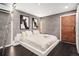 Stylish bedroom with a modern bed frame, wood floors, and minimalist wall art at 720 Lipan St, Denver, CO 80204