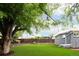 Private backyard featuring a lush lawn and mature trees at 7695 Quitman St, Westminster, CO 80030