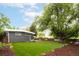 Spacious backyard with well-maintained lawn and mature tree at 7695 Quitman St, Westminster, CO 80030