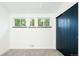 Bright bedroom features three windows and a modern sliding-door closet for ample storage at 7695 Quitman St, Westminster, CO 80030