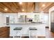 Kitchen island provides seating and a sleek cooktop, complemented by stainless steel appliances at 7695 Quitman St, Westminster, CO 80030
