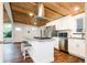 Kitchen with a stylish wood ceiling, modern appliances, and a functional center island at 7695 Quitman St, Westminster, CO 80030