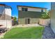 Picture of the backyard with grassy area, rock landscaping, and fencing at 19120 E 54Th Pl, Denver, CO 80249