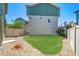 View of the home's exterior with a small grass backyard and rock area at 19120 E 54Th Pl, Denver, CO 80249