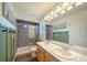 Beautiful bathroom boasts a double vanity, modern lighting, and walk-in shower for a spa-like experience at 19120 E 54Th Pl, Denver, CO 80249