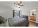 Bedroom showcasing a serene atmosphere with view from the window, dresser, and access to the en-suite bathroom at 19120 E 54Th Pl, Denver, CO 80249