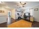 Bonus room with dark wood floors, exercise equipment and desk space at 19120 E 54Th Pl, Denver, CO 80249