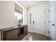 Bright entryway featuring a console table under a large window, next to the front door, creating a welcoming ambiance at 19120 E 54Th Pl, Denver, CO 80249