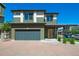 Charming two-story home with a front garage and a welcoming entrance with pleasant, easy-to-maintain landscaping at 19120 E 54Th Pl, Denver, CO 80249