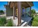 Close-up view of a welcoming front porch with seating, charming details, and attractive landscaping at 19120 E 54Th Pl, Denver, CO 80249
