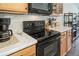 Close up of stainless steel appliances, mosaic backsplash and wood cabinets at 19120 E 54Th Pl, Denver, CO 80249