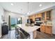Spacious eat-in kitchen with large island, stainless appliances, and sliding glass doors at 19120 E 54Th Pl, Denver, CO 80249