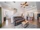 Cozy living room with a comfortable sofa, view of the front door and an open layout leading to the kitchen at 19120 E 54Th Pl, Denver, CO 80249