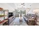 Spacious living room with neutral paint, wood floors and lots of natural light at 19120 E 54Th Pl, Denver, CO 80249