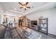 Open-concept living room and kitchen area with sleek hardwood floors and modern decor for comfortable living at 19120 E 54Th Pl, Denver, CO 80249