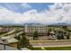 Breathtaking aerial view of the community, showcasing the building, landscape, and mountain views at 13456 Via Varra # 401, Broomfield, CO 80020