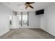 Bedroom with ceiling fan, mounted tv and natural light at 13456 Via Varra # 401, Broomfield, CO 80020