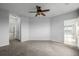 Bedroom with ceiling fan and open entry to bathroom at 13456 Via Varra # 401, Broomfield, CO 80020