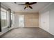 Bright bedroom boasting carpet floors, natural light, and wood accent wall; spacious and welcoming retreat at 13456 Via Varra # 401, Broomfield, CO 80020