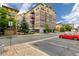 Exterior view of a Vantage Pointe building, featuring architecture, balconies, trees, and parking at 13456 Via Varra # 401, Broomfield, CO 80020