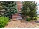 Attractive Vantage Pointe community sign amidst lush landscaping, stone accents, and healthy trees at 13456 Via Varra # 401, Broomfield, CO 80020