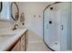 Clean bathroom with double sinks and a walk-in shower at 9303 W 66Th Pl, Arvada, CO 80004