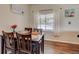 Bright dining area with window and hardwood floors at 9303 W 66Th Pl, Arvada, CO 80004