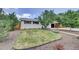 Charming single-story home with a freshly mowed lawn and a well-maintained exterior at 9303 W 66Th Pl, Arvada, CO 80004