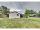 Large backyard with grassy area and a view of the house at 9303 W 66Th Pl, Arvada, CO 80004