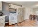 Modern kitchen with stainless steel appliances and white cabinetry at 9303 W 66Th Pl, Arvada, CO 80004