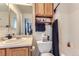 Traditional bathroom with wooden cabinets, vanity and shower and tub combo at 11120 Josephine Way, Northglenn, CO 80233