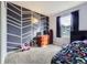 Fun bedroom with a painted accent wall and a window for natural light at 11120 Josephine Way, Northglenn, CO 80233