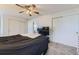 Well-lit bedroom featuring ceiling fan, neutral colors and closet doors at 11120 Josephine Way, Northglenn, CO 80233