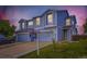Beautiful two-story townhome showcasing a tidy lawn, neutral siding, and a welcoming front entrance at 11120 Josephine Way, Northglenn, CO 80233