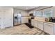 Charming kitchen with stainless appliances, ample cabinet space, and wood-look floors at 11120 Josephine Way, Northglenn, CO 80233