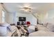 Comfortable living room with neutral-toned furniture, geometric rug, and a ceiling fan at 11120 Josephine Way, Northglenn, CO 80233