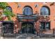 Beautiful brick building entrance with elegant doors, an awning and well-maintained landscaping exudes sophisticated charm at 1720 Wynkoop St # Ph403, Denver, CO 80202